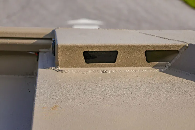 Slide: The Image of Close-up of 2026 Excel Switchblade vehicle detail with textured surface and small windows. - 10