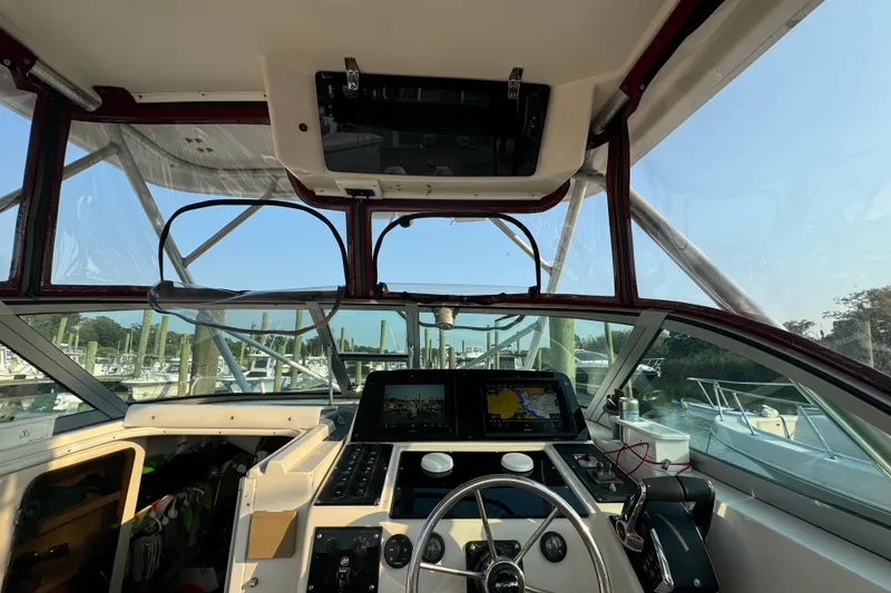 Slide: The Image of Interior view of 1996 Pro-Line 2950 Walkaround boat cockpit with navigation equipment. - 16