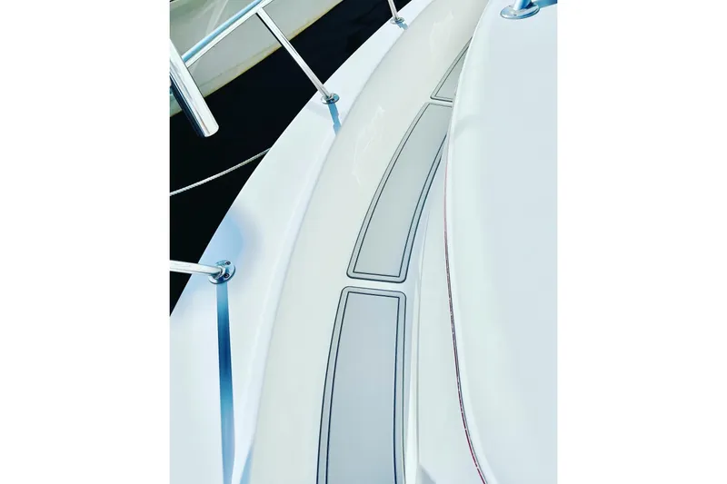 Slide: The Image of 1996 Pro-Line 2950 Walkaround boat deck with stainless steel railings. - 8