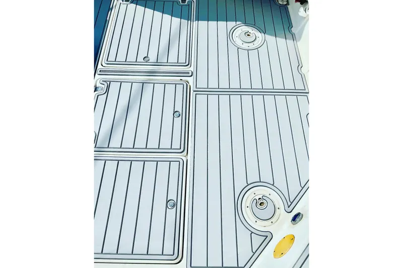 Slide: The Image of Deck of 1996 Pro-Line 2950 Walkaround boat with storage compartments. - 9