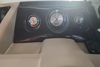 Slide: The Image of Dashboard of a 2014 Bennington S21 boat with gauges and controls. - 21