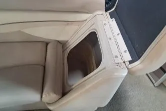 Slide: The Image of 2014 Bennington S21 boat seat with storage compartment open. - 22
