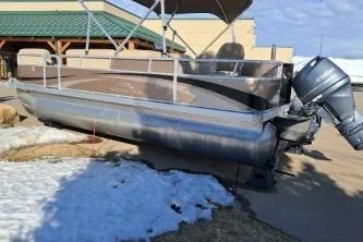 Slide: The Image of 2014 BENNIGTON S21 pontoon boat parked on snowy ground. - 4