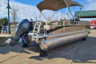 Slide: The Image of 2014 BENNIGTON S21 pontoon boat with canopy and outboard motor on display. - 5