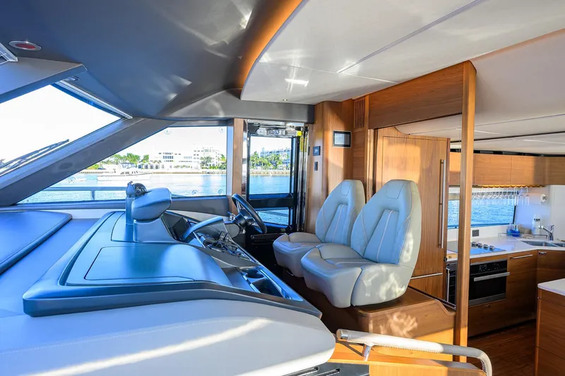 Slide: The Image of Luxurious interior of 2021 Princess Y78 yacht with modern helm and kitchen area. - 15
