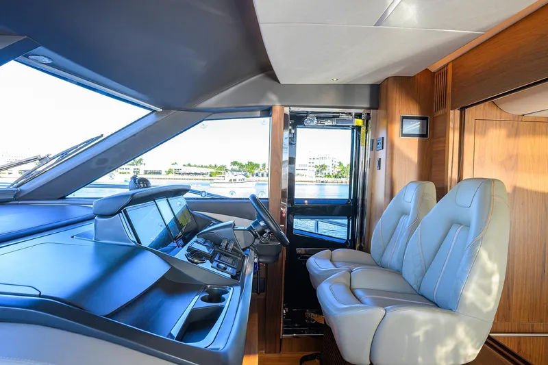 Slide: The Image of Luxurious interior of 2021 Princess Y78 yacht with modern helm and plush seating. - 16