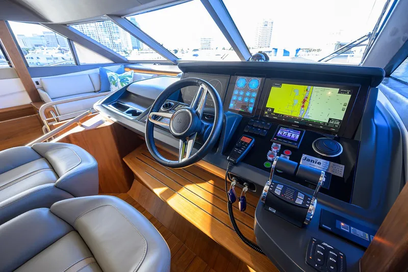 Slide: The Image of Luxurious 2021 Princess Y78 yacht helm with advanced navigation systems and plush seating. - 17