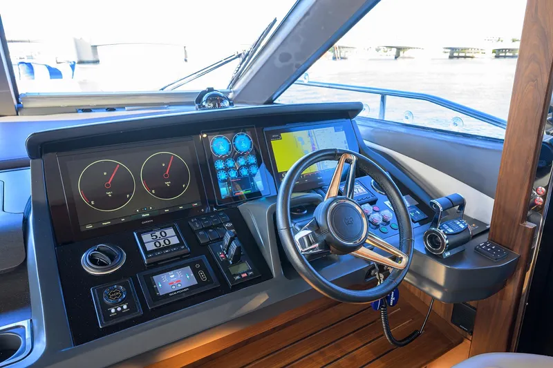 Slide: The Image of Luxurious 2021 Princess Y78 yacht helm with advanced navigation controls and sleek design. - 18