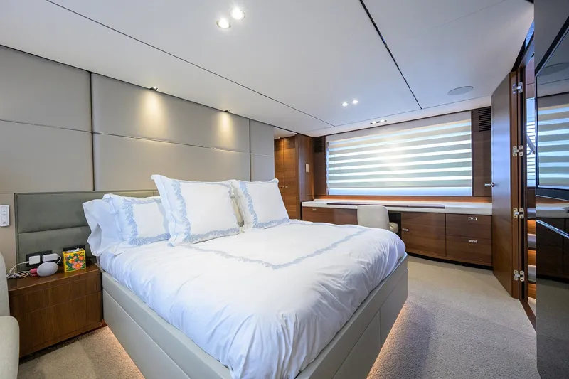 Slide: The Image of Luxurious bedroom interior on a 2021 Princess Y78 yacht, featuring elegant design and modern amenities. - 21