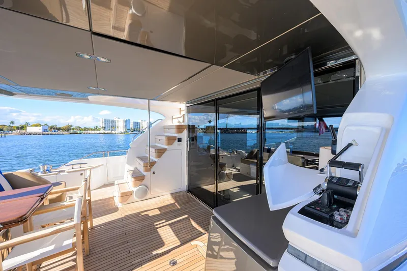 Slide: The Image of Luxurious 2021 Princess Y78 yacht deck with seating, stairs, and ocean view. - 3
