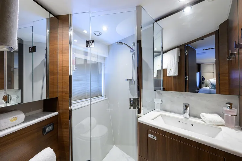 Slide: The Image of Luxurious bathroom in 2021 Princess Y78 yacht with modern fixtures and elegant wood finishes. - 31