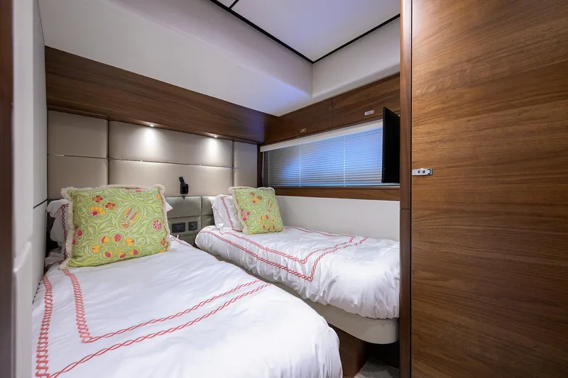 Slide: The Image of Luxurious twin bedroom in 2021 Princess Y78 yacht with elegant wood paneling. - 32