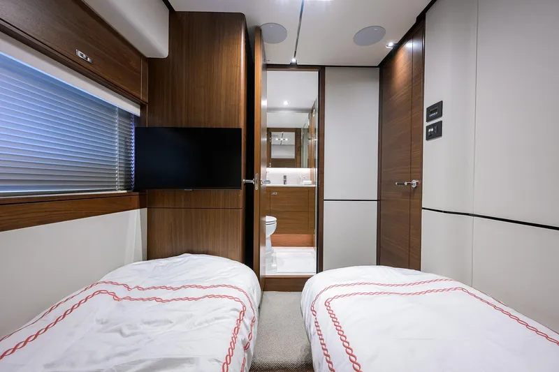Slide: The Image of Interior of 2021 Princess Y78 yacht cabin with twin beds and ensuite bathroom. - 34