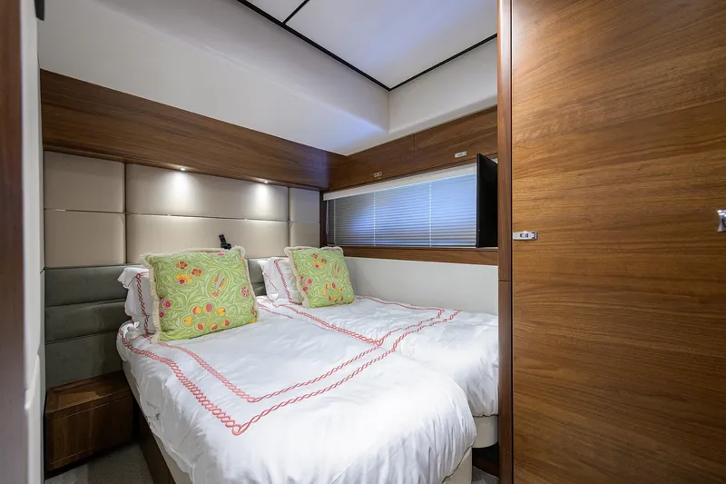 Slide: The Image of Luxurious cabin interior of 2021 Princess Y78 yacht with twin beds and elegant decor. - 35