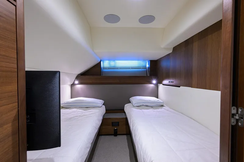Slide: The Image of Luxurious twin cabin interior of 2021 Princess Y78 yacht with modern wood finishes. - 39