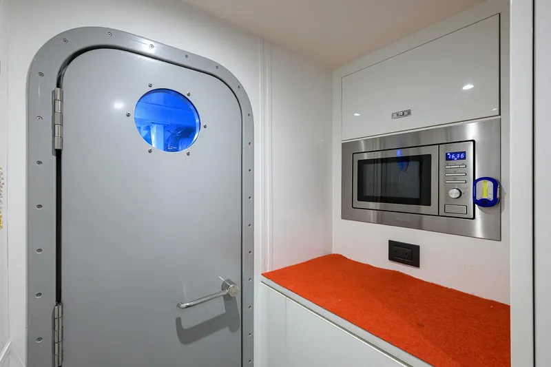 Slide: The Image of Modern yacht interior with microwave and porthole door, Princess Y78, 2021 model. - 45