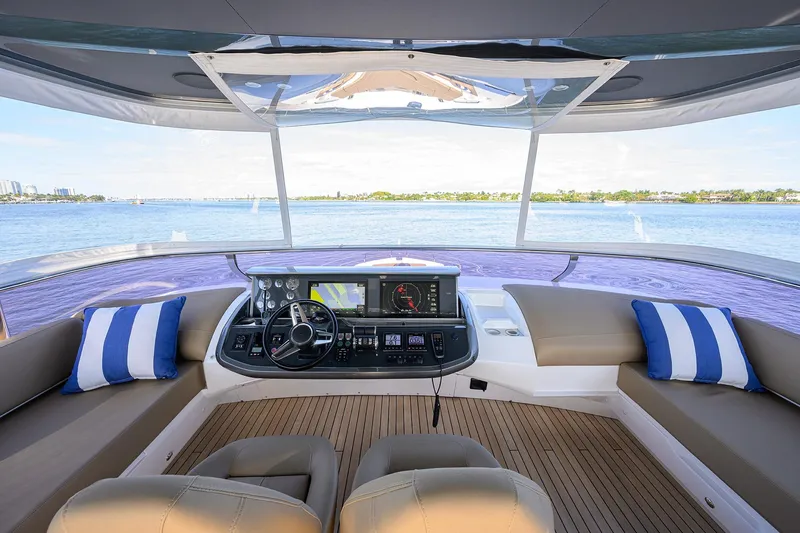 Slide: The Image of Luxurious 2021 Princess Y78 yacht helm with panoramic ocean view and plush seating. - 47
