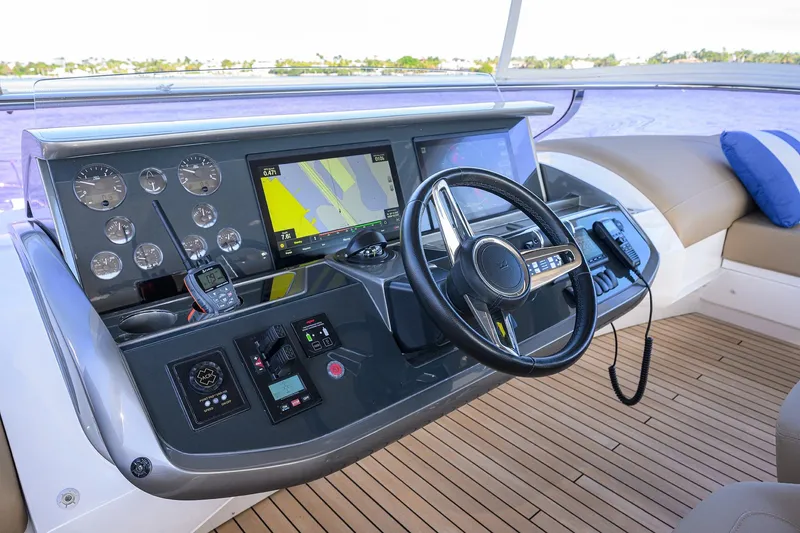 Slide: The Image of Helm of 2021 Princess Y78 yacht with navigation controls and display. - 51
