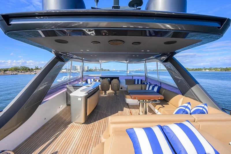Slide: The Image of Luxurious 2021 Princess Y78 yacht deck with seating, ocean view, and striped cushions. - 61