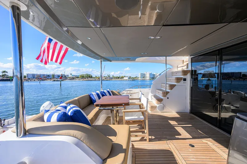 Slide: The Image of Luxurious 2021 Princess Y78 yacht deck with seating, table, and ocean view. - 63