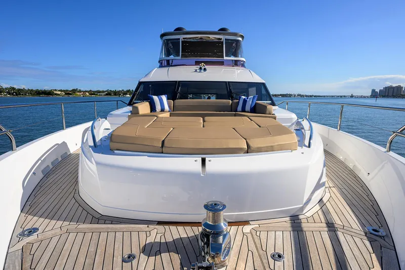 Slide: The Image of Luxurious 2021 Princess Y78 yacht with spacious deck and sunbathing area on open water. - 71