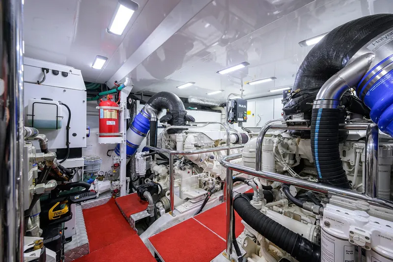 Slide: The Image of Engine room of 2021 Princess Y78 yacht with advanced machinery and red carpet flooring. - 74