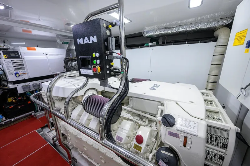 Slide: The Image of Engine room of 2021 Princess Y78 yacht featuring MAN V12 engine. - 79