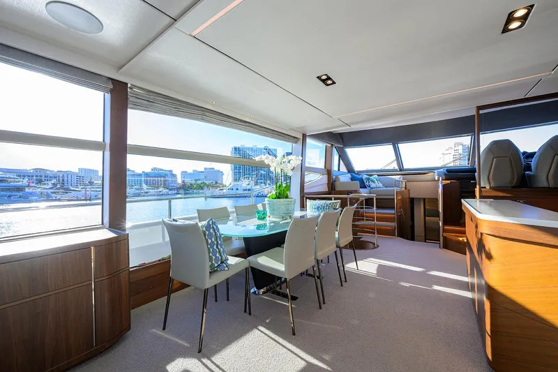 Slide: The Image of Luxurious interior of 2021 Princess Y78 yacht with elegant dining area and panoramic windows. - 8