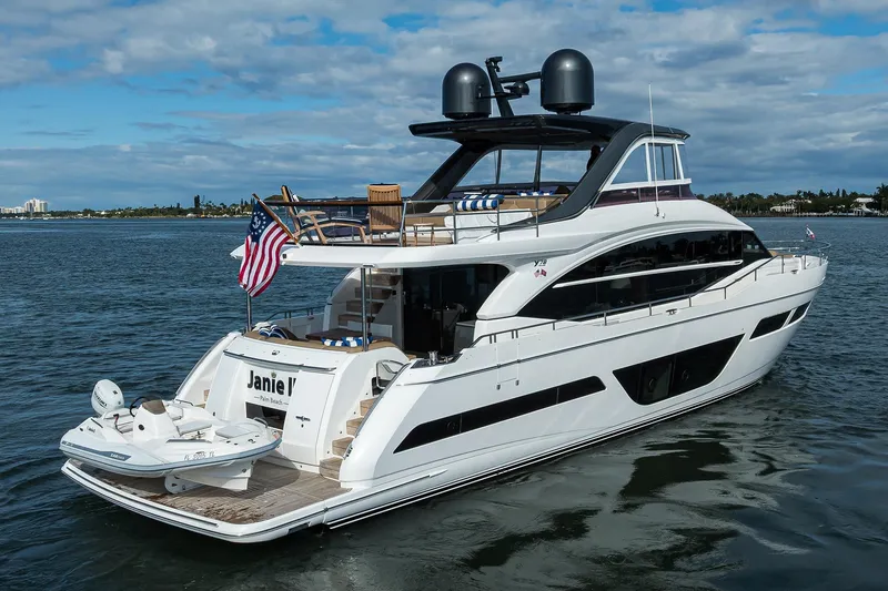 Slide: The Image of Luxury 2021 Princess Y78 yacht on water, featuring sleek design and American flag. - 89