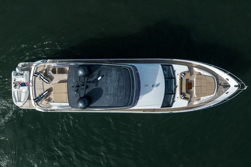 Slide: The Image of Overhead view of 2021 Princess Y78 yacht on water, showcasing sleek design and spacious deck. - 91