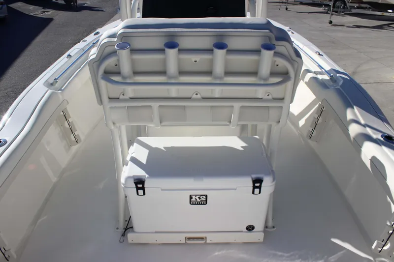 Slide: The Image of 2026 Key West 219 FS boat interior with rod holders and cooler. - 10