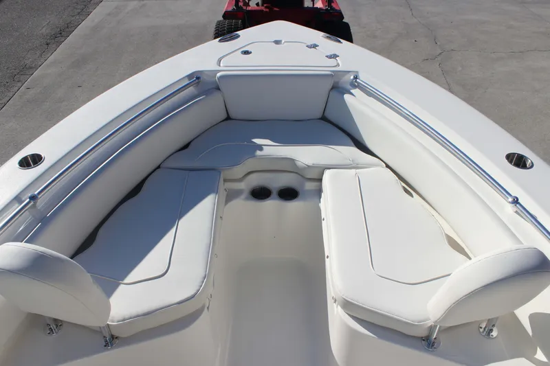 Slide: The Image of 2026 Key West 219 FS boat interior with white cushioned seating. - 11