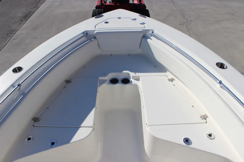 Slide: The Image of 2026 Key West 219 FS boat interior, featuring spacious seating and storage compartments. - 12