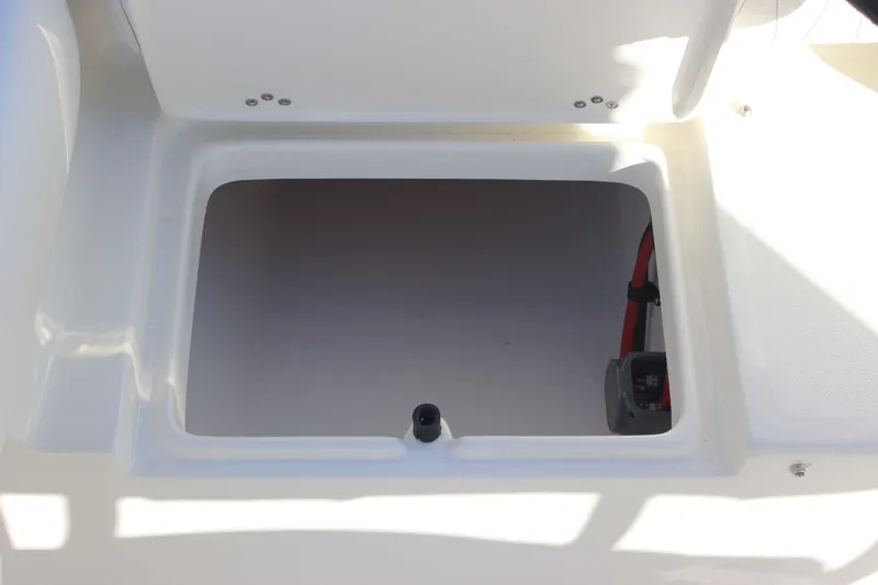 Slide: The Image of Storage compartment of 2026 Key West 219 FS boat, featuring a clean, white interior. - 19