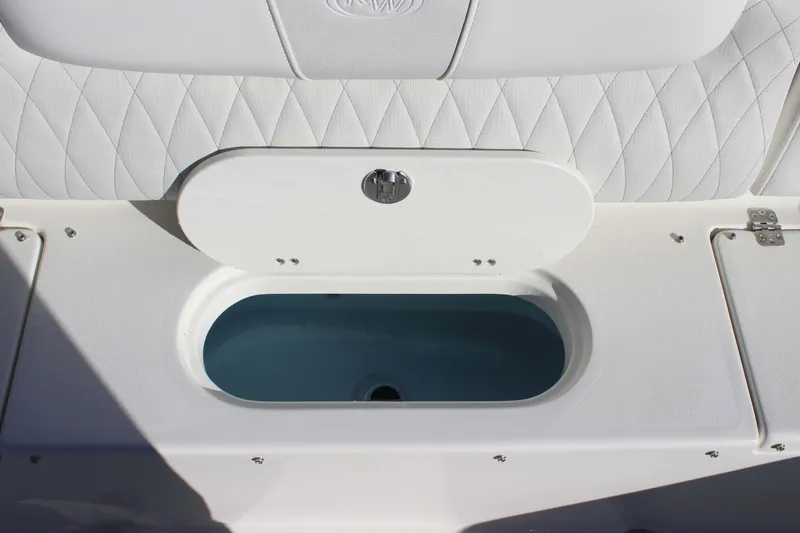 Slide: The Image of 2026 Key West 219 FS boat interior with open storage compartment. - 20