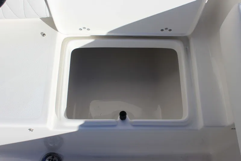 Slide: The Image of Open storage compartment on 2026 Key West 219 FS boat. - 21