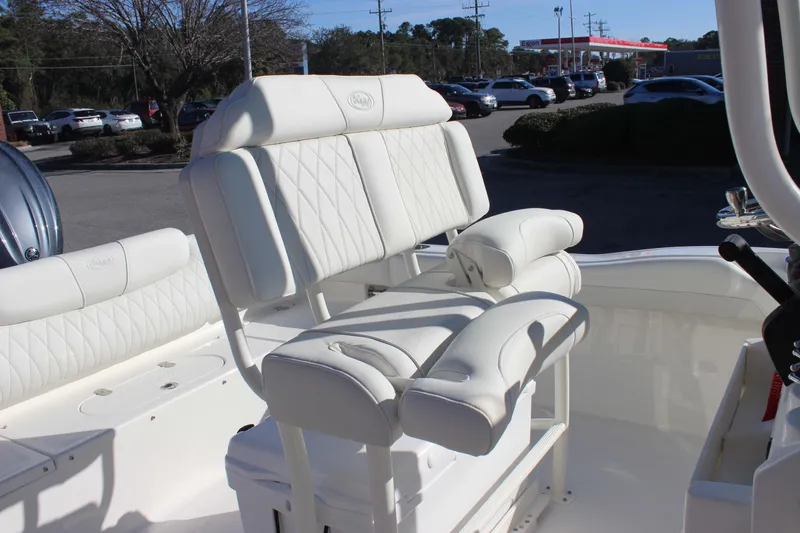 Slide: The Image of Luxurious seating on 2026 Key West 219 FS boat, featuring white cushioned upholstery. - 9