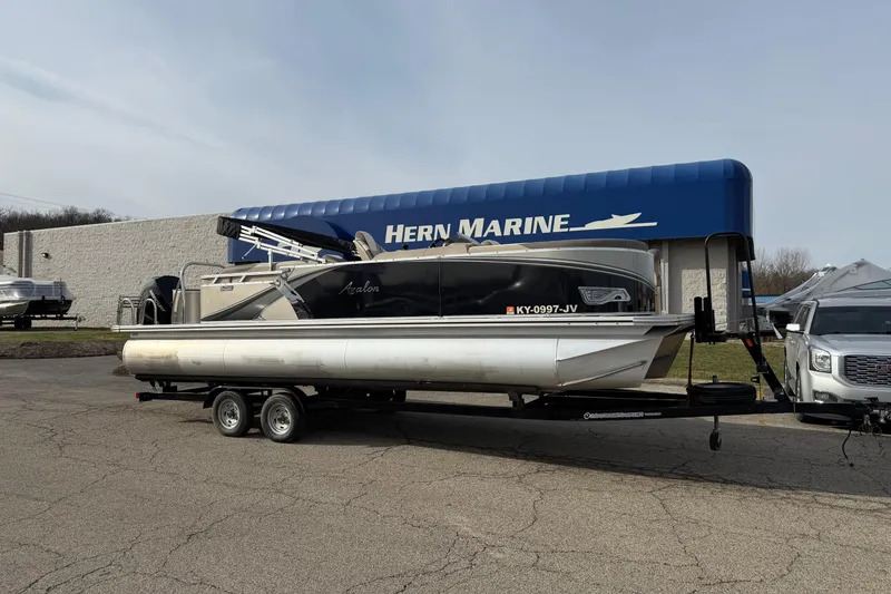 Slide: The Image of 2023 Avalon LSZ QUAD LOUNGE pontoon boat on trailer at Hern Marine dealership. - 0
