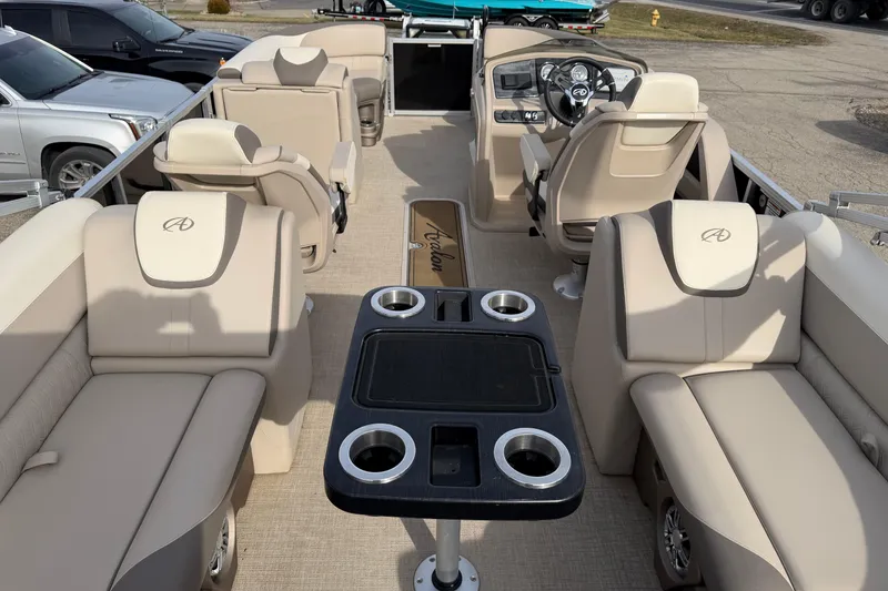 Slide: The Image of 2023 Avalon LSZ QUAD LOUNGE interior with beige seating and central table. - 3