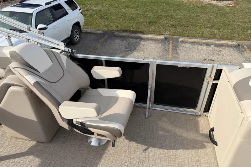 Slide: The Image of 2023 Avalon LSZ QUAD LOUNGE boat interior with beige seating and armrests. - 7