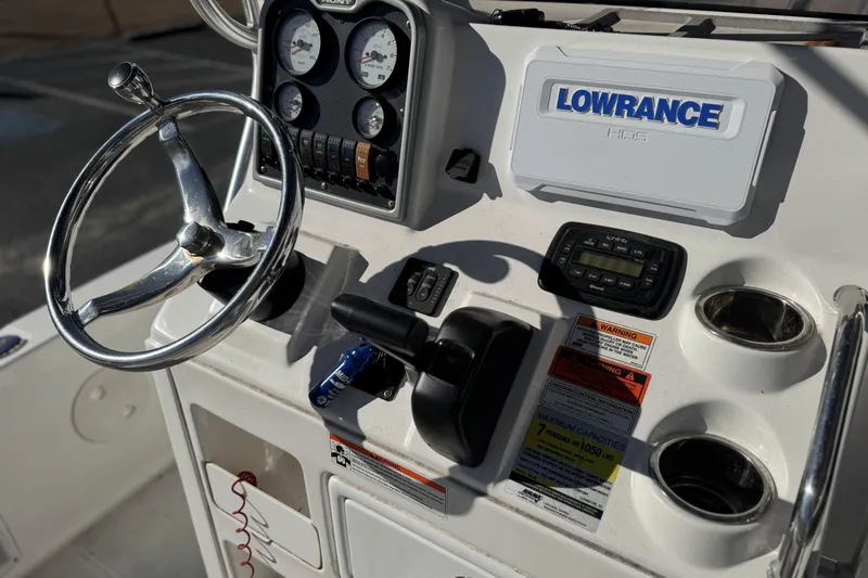 Slide: The Image of 2013 Sea Hunt BX 20 BR boat dashboard with steering wheel and Lowrance GPS system. - 10