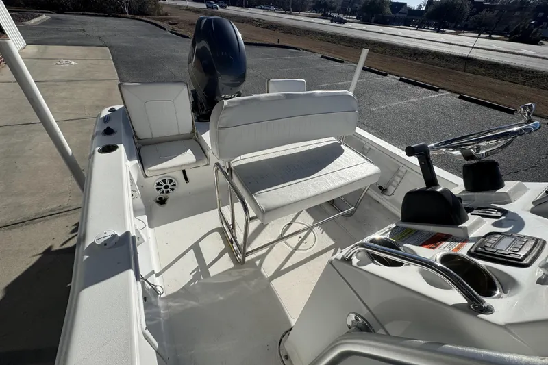 Slide: The Image of 2013 Sea Hunt BX 20 BR boat interior with seating and control console. - 13