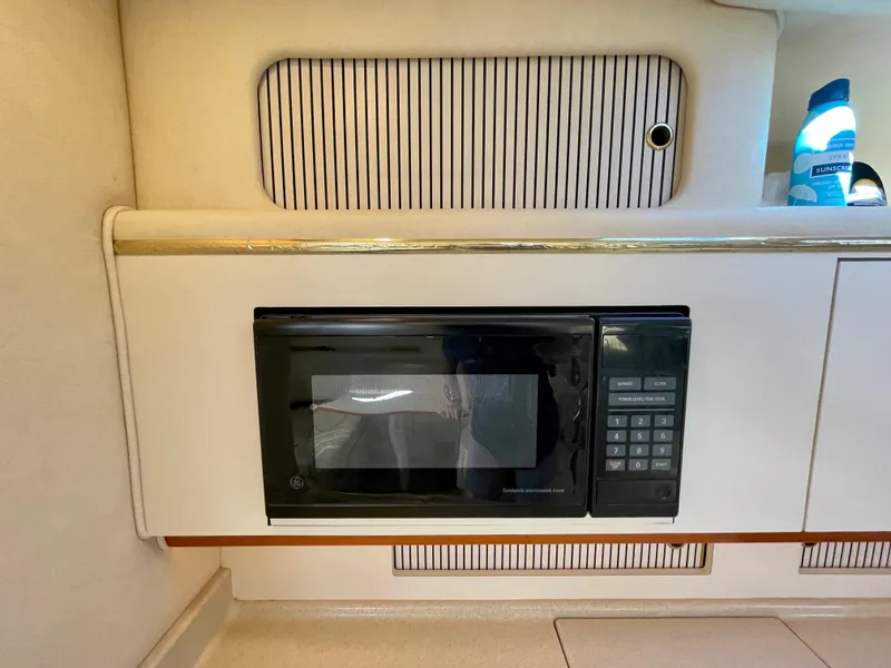 Slide: The Image of Microwave in 2001 Sea Ray Sundancer 310 yacht interior. - 23
