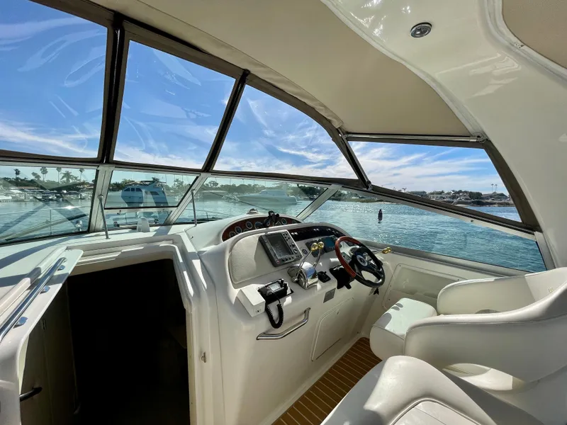 Slide: The Image of Interior of a 2001 Sea Ray Sundancer 310 yacht overlooking the water. - 29