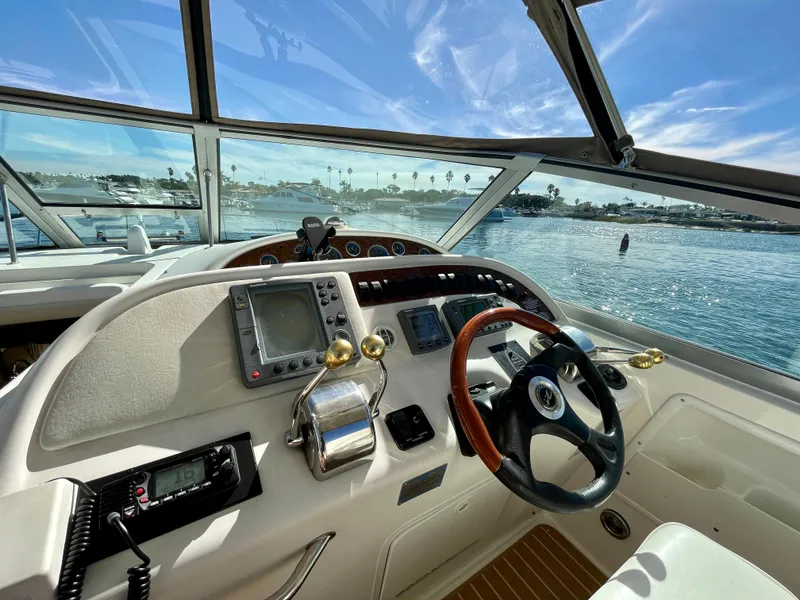 Slide: The Image of Cockpit of 2001 Sea Ray Sundancer 310 overlooking the water. - 30