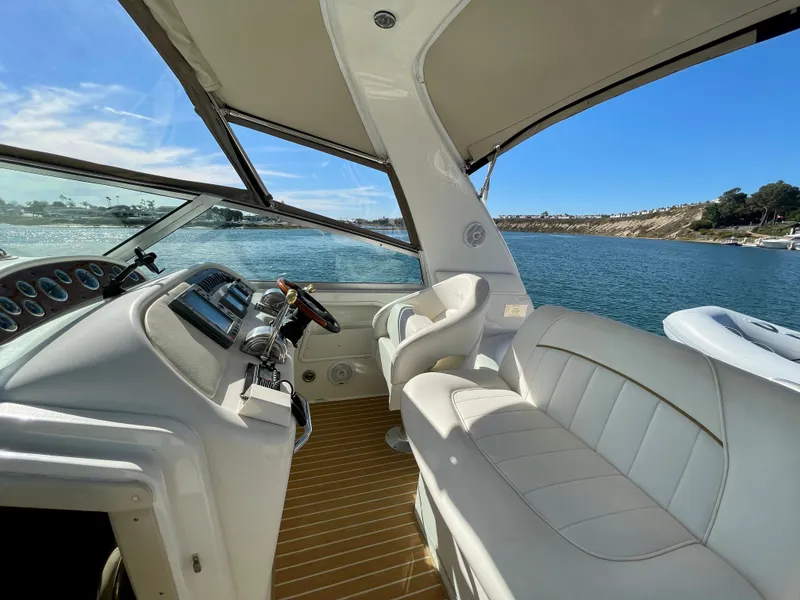 Slide: The Image of Interior of a 2001 Sea Ray Sundancer 310 yacht on the water. - 33