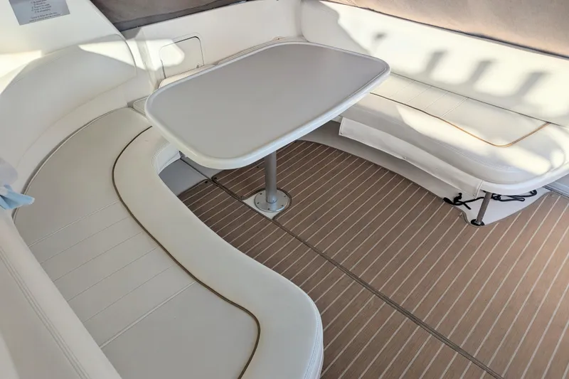 Slide: The Image of 2001 Sea Ray Sundancer 310 interior with white seating and table. - 36