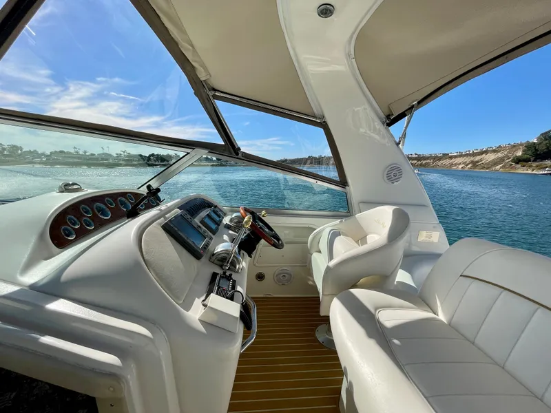 Slide: The Image of Interior of a 2001 Sea Ray Sundancer 310 yacht overlooking the water. - 39