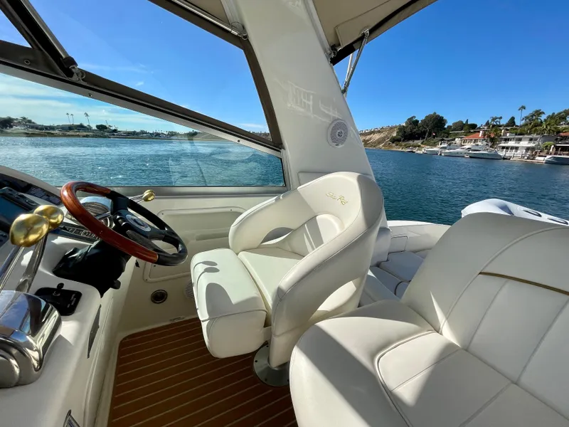 Slide: The Image of Interior of a 2001 Sea Ray Sundancer 310 yacht overlooking the water. - 44