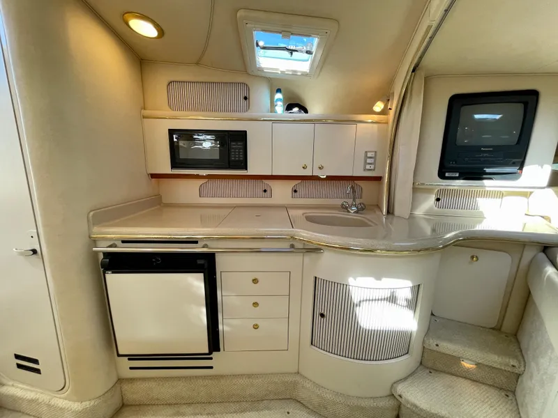 Slide: The Image of Interior of 2001 Sea Ray Sundancer 310 yacht with kitchenette. - 9